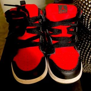 Red black and white high top Jordans.